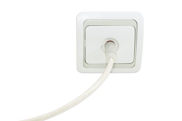 Plugging coaxial cable into wall socket