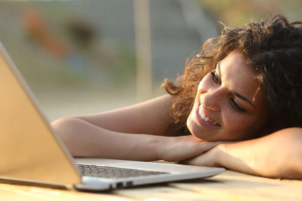 woman watching tv on laptop