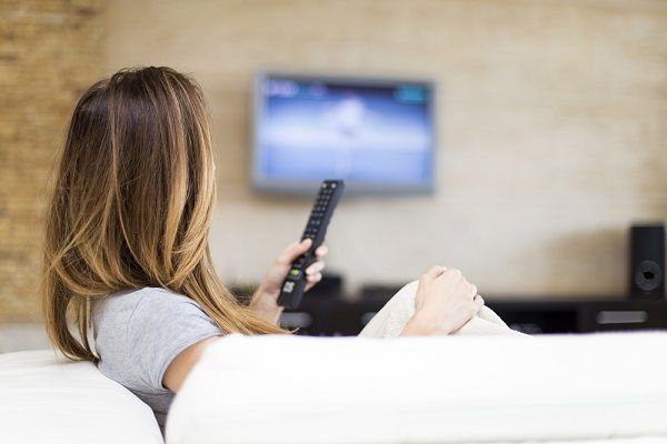 young woman watching television