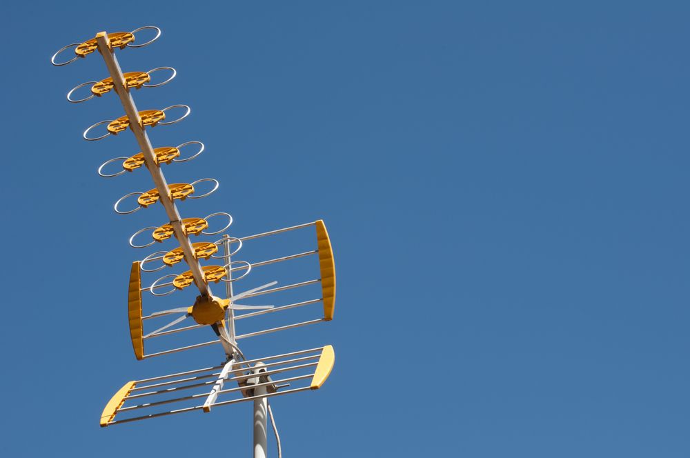 tv antenna against blue sky