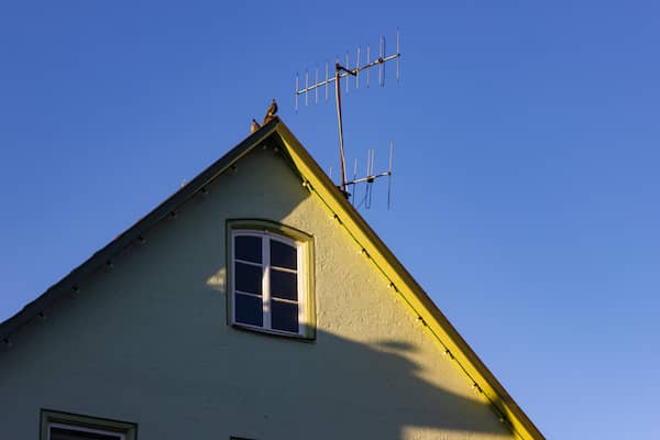 TV antenna on roof of house