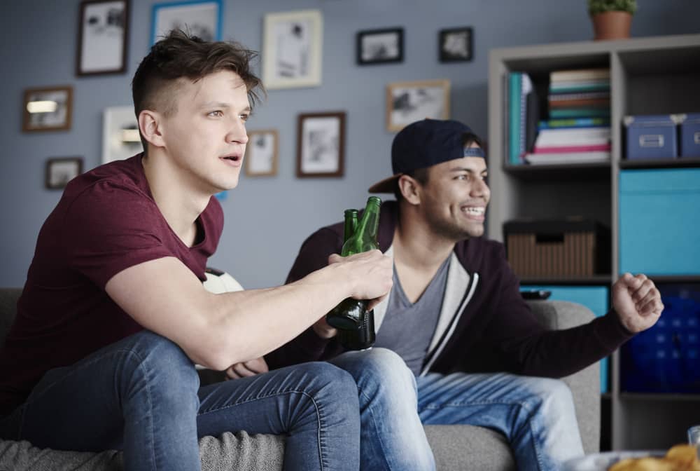 two guys cheering a game